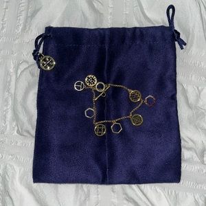 Brand new gold Tory Burch charm bracelet